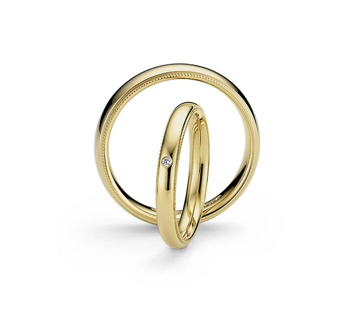 Trauringpaar Art Deco Gelbgold 4,0 mm gewölbt mit Brillant 0,030ct