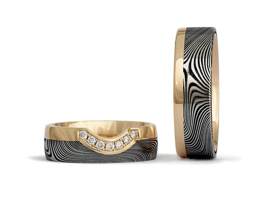 Trauringpaar Damaszenerstahl Gelbgold mit Brillanten 0,105ct Sonderedition Juwelier Roller